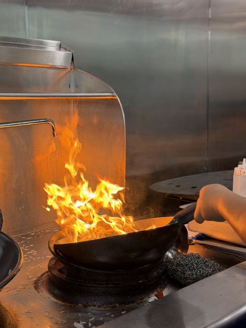 Cooking over open flame in the Mahek kitchen